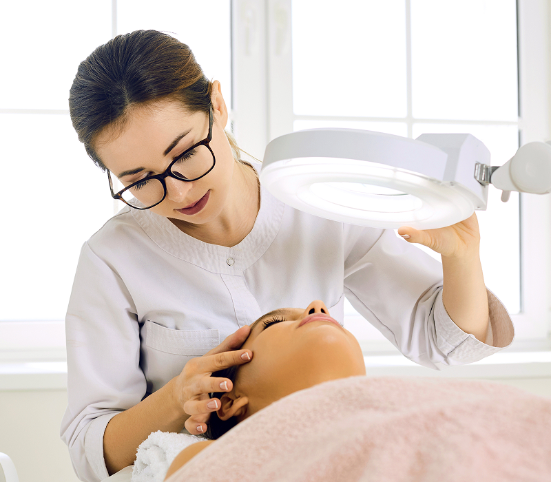 Skincare treatment in a bright, modern clinic.